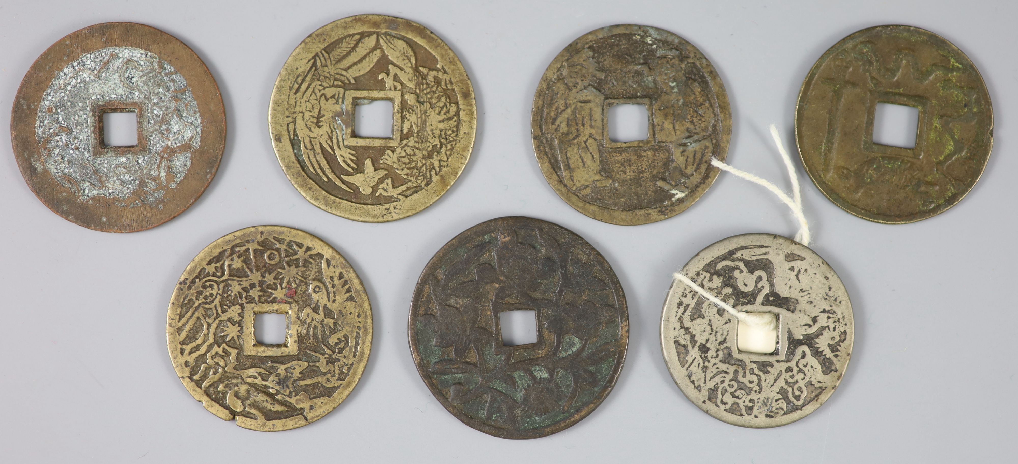 China, a group of 7 bronze charms or amulets, Qing dynasty,